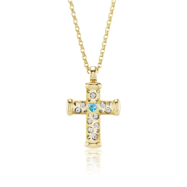 A gold cross with blue and white stones.