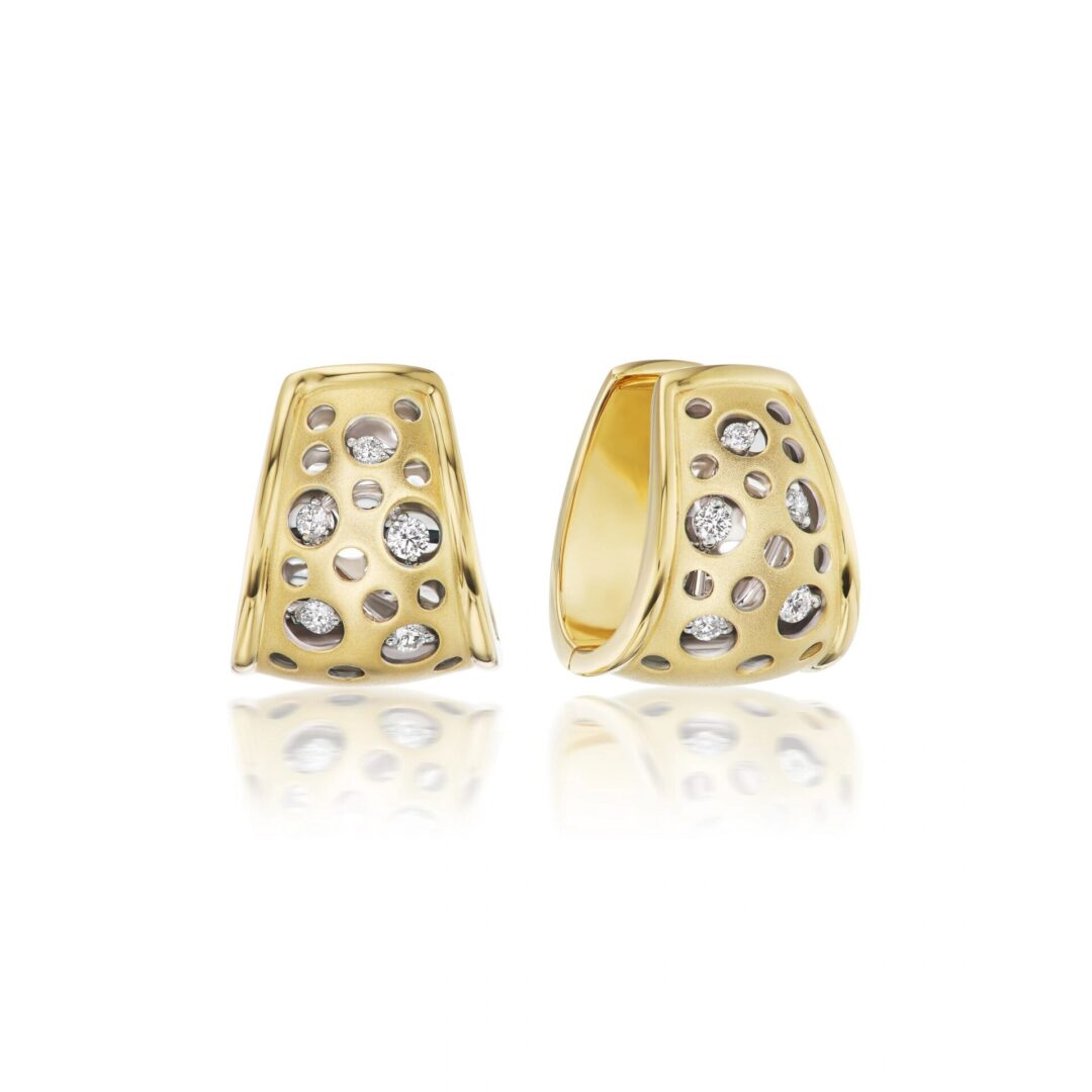 A pair of gold earrings with diamonds on top.