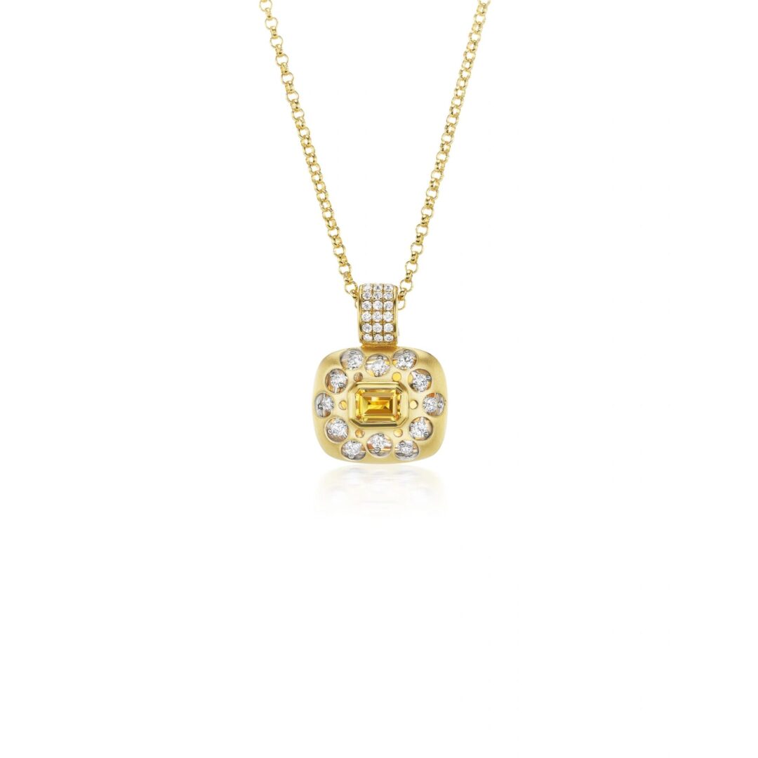 A yellow gold necklace with a diamond and white stone pendant.