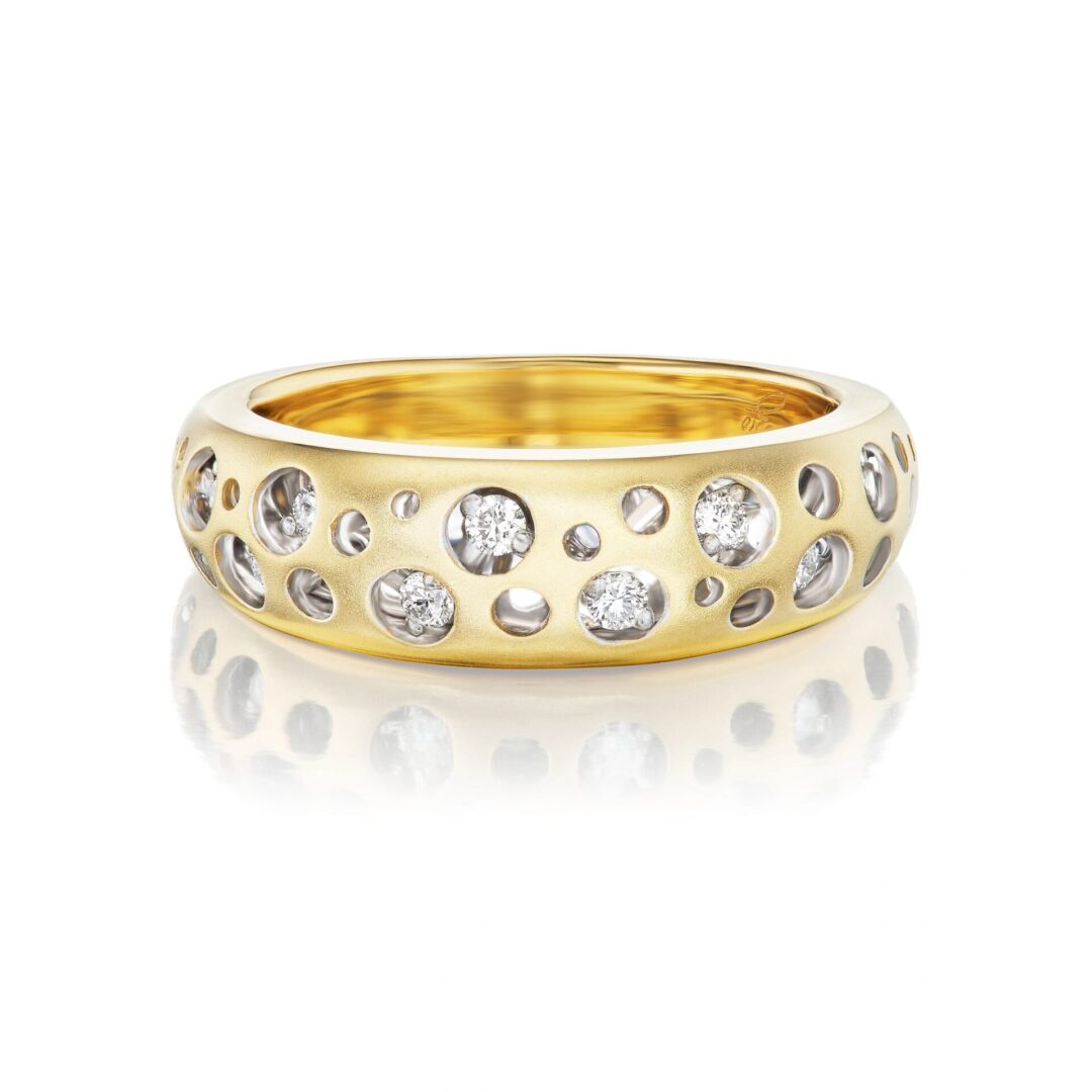 A gold ring with diamonds on top of it.