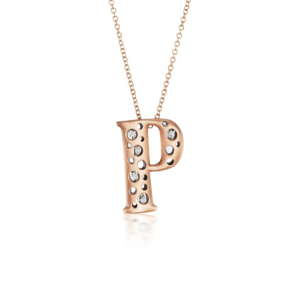 A rose gold necklace with the letter p