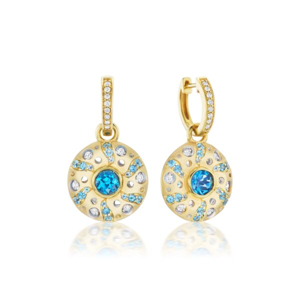 A pair of gold earrings with blue and white stones.