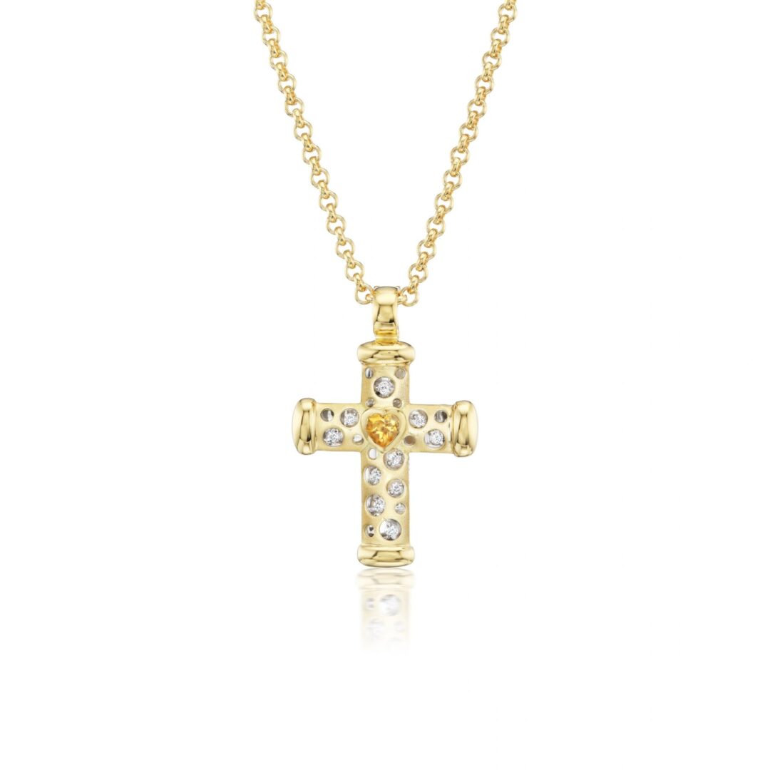 A gold cross with diamonds on it's side.
