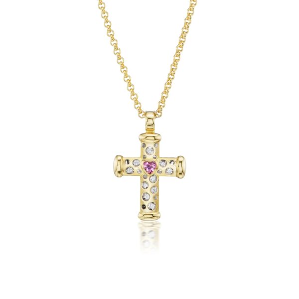 A gold cross with pink and white stones.