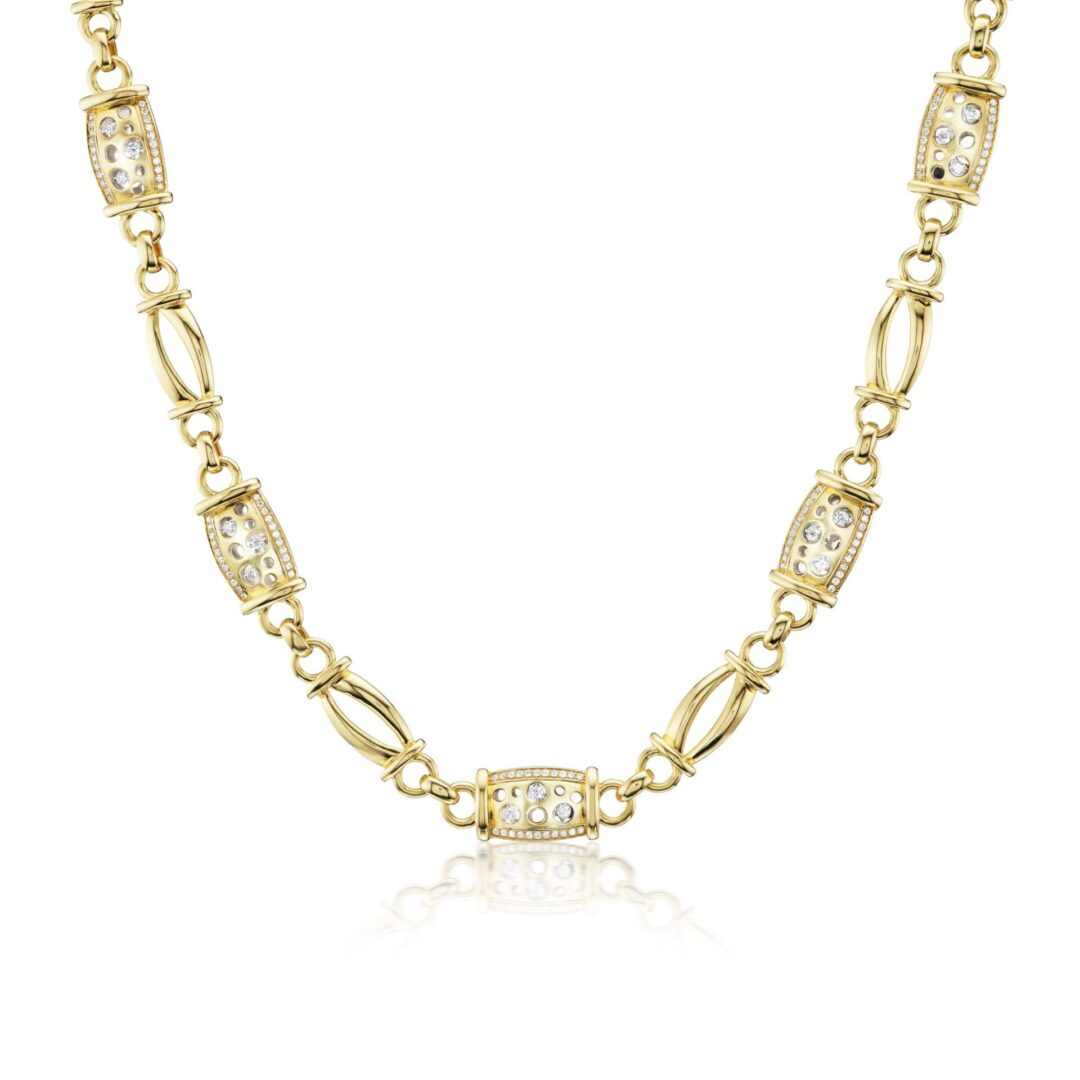 A gold chain with a diamond necklace on it.