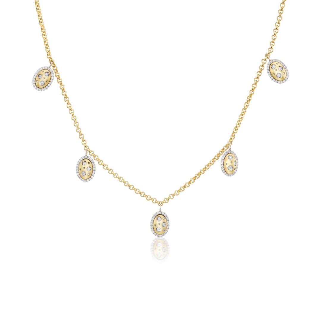 A gold necklace with five small oval shaped charms.