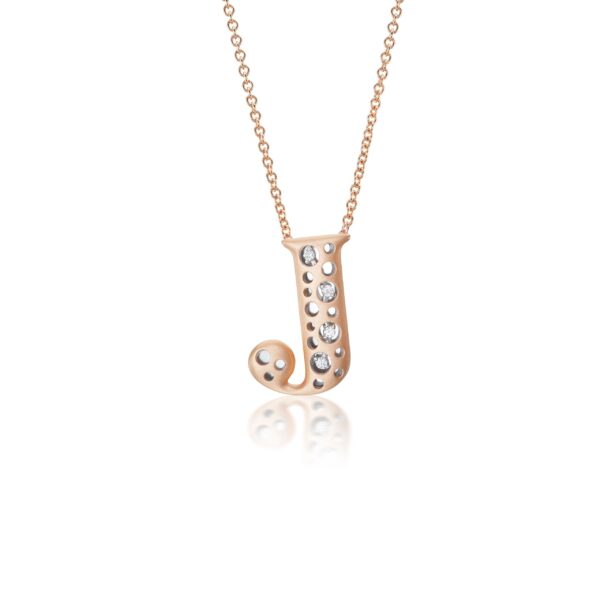 A rose gold necklace with a letter j on it.