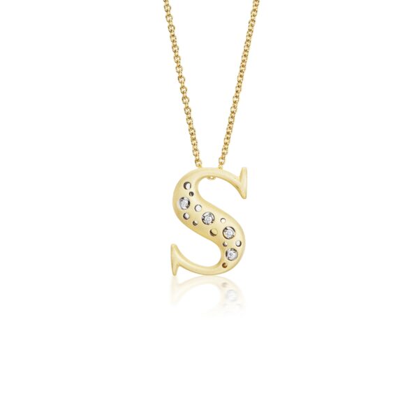 A gold necklace with the letter s