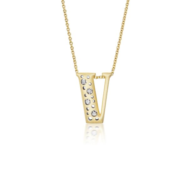 A gold necklace with a letter v on it