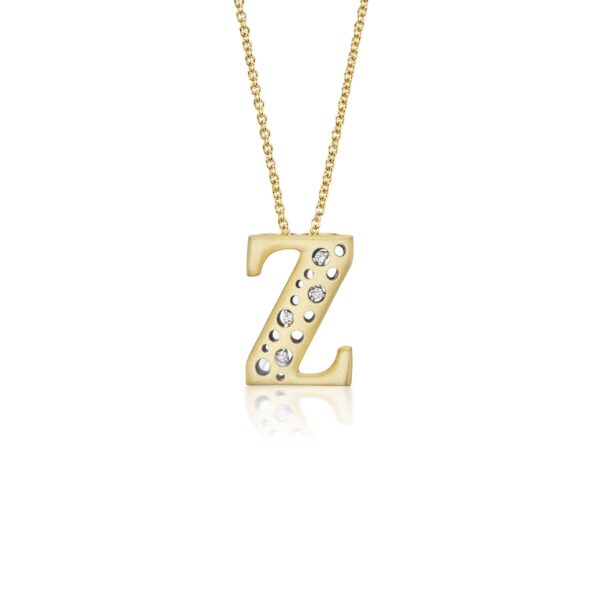A gold necklace with the letter z