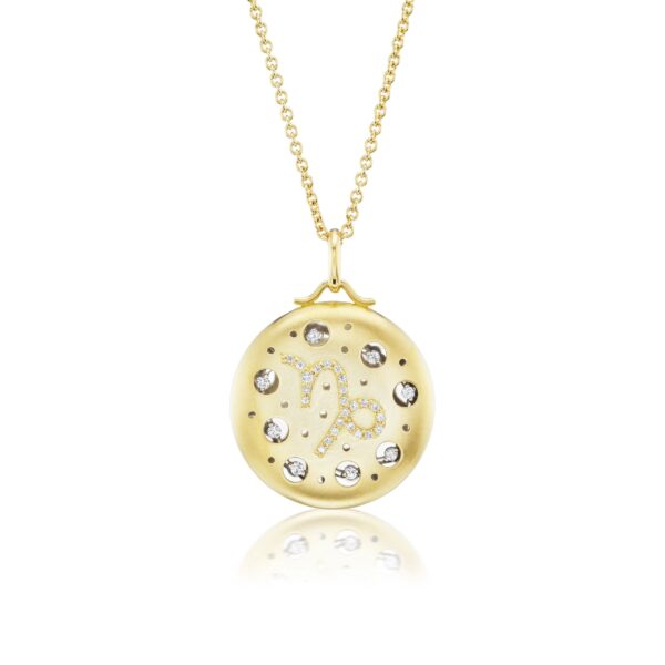 A gold necklace with a round pendant and diamond accents.