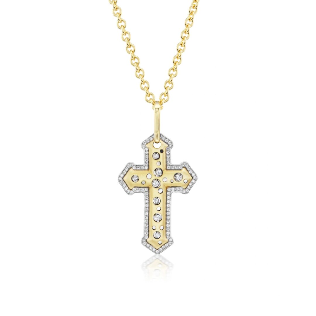 A cross is shown with a diamond on it.