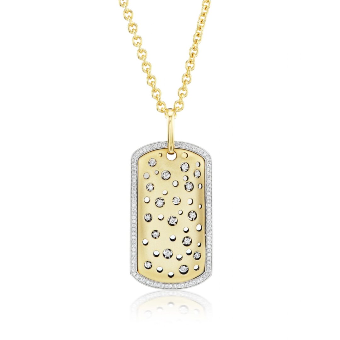 A gold and diamond dog tag necklace.