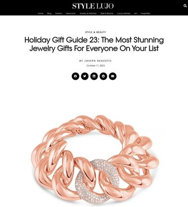 A rose gold chain bracelet with diamonds on top of it.