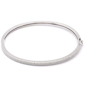 Silver bangle bracelet with diamond accents.