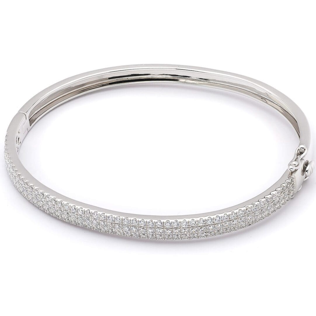 Silver bangle bracelet with diamond accents.