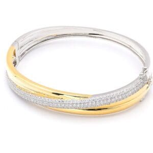 Gold and silver bangle with diamonds.