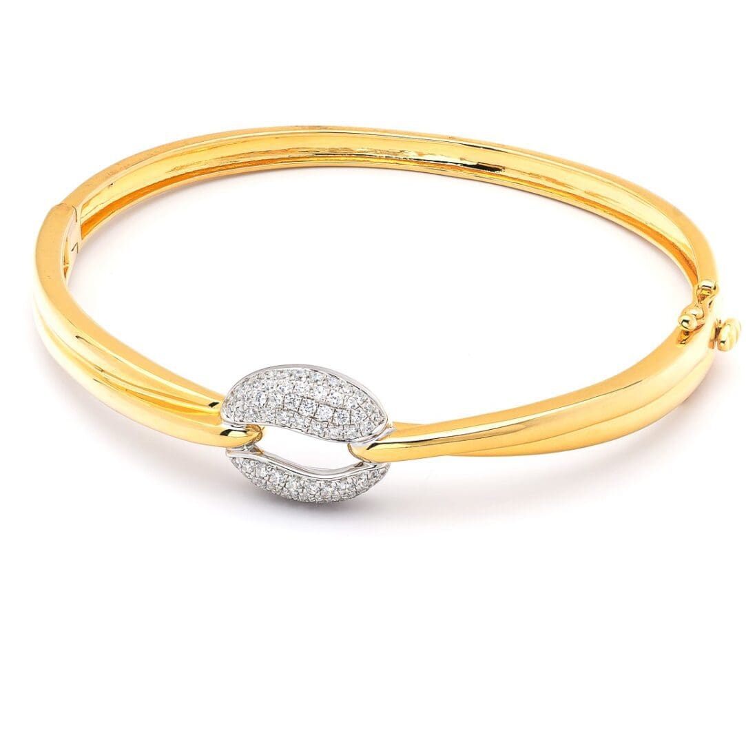 Gold bangle with diamond clasp.