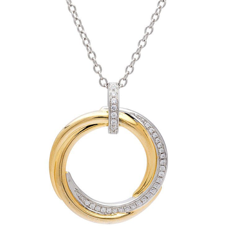 Two-tone circle pendant with diamond accents.