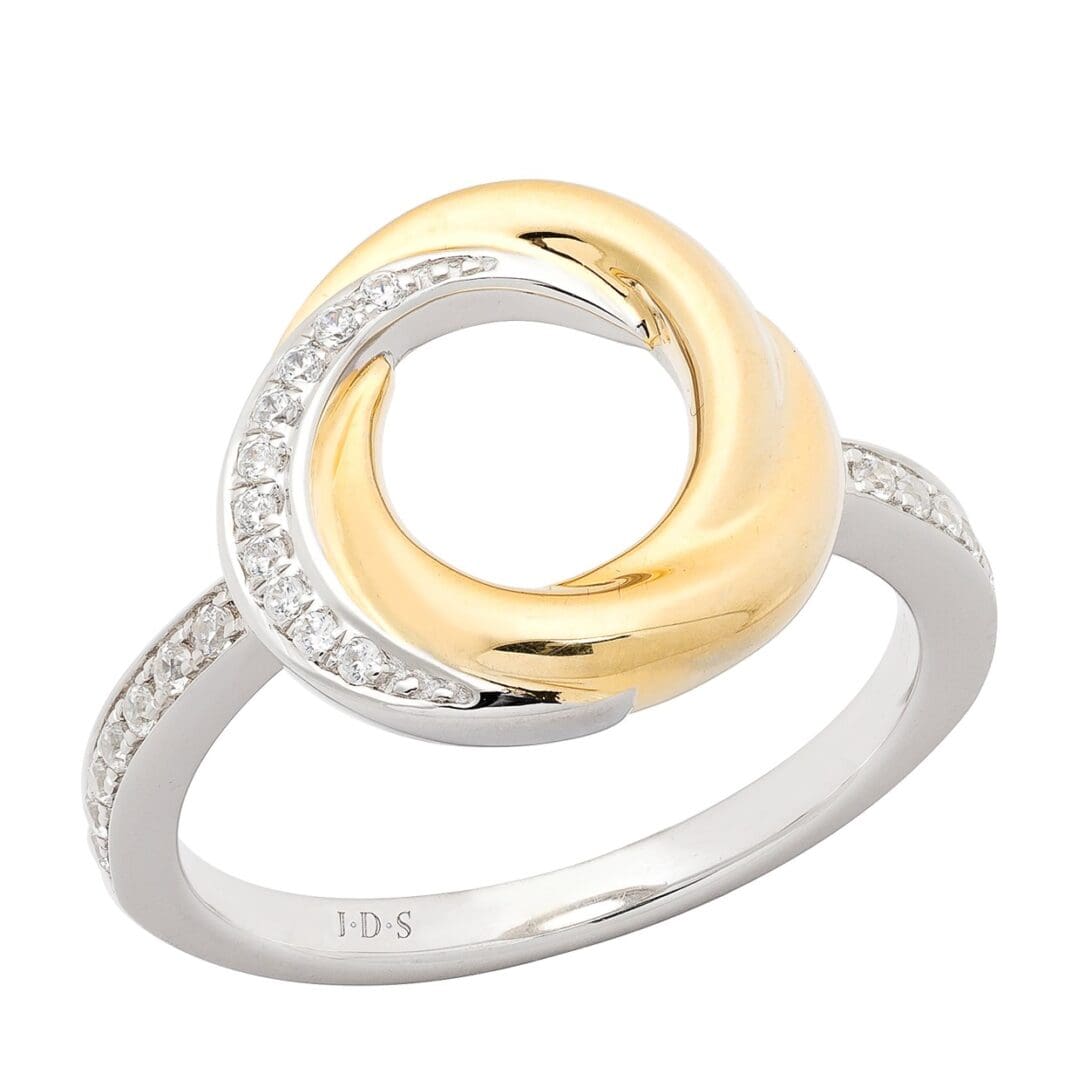 Two-tone ring with diamond accents.