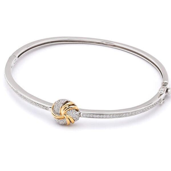 Diamond bangle with knot detail.