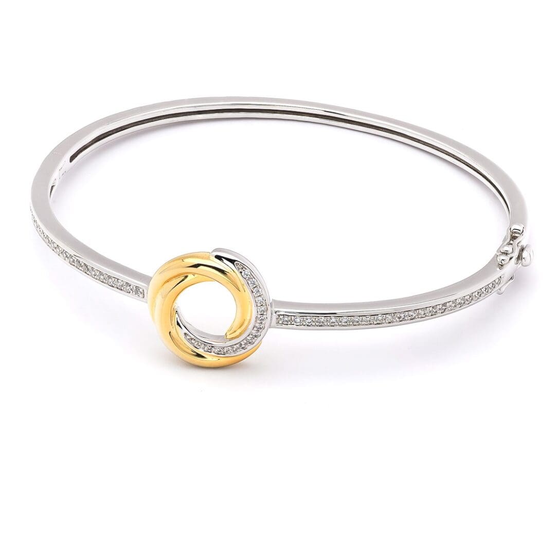 Diamond and gold circle bangle bracelet.