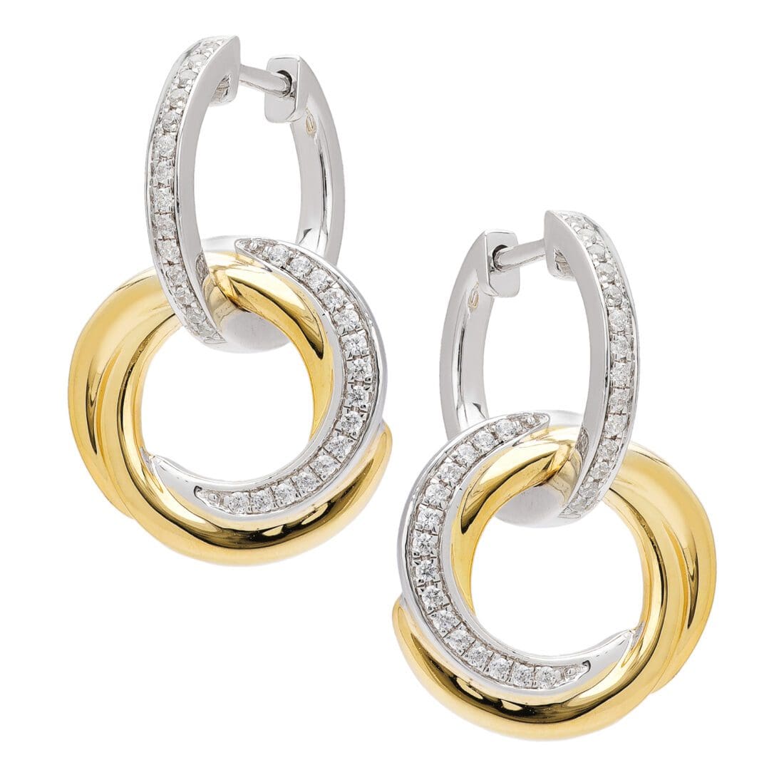 Diamond hoop earrings in gold and silver.